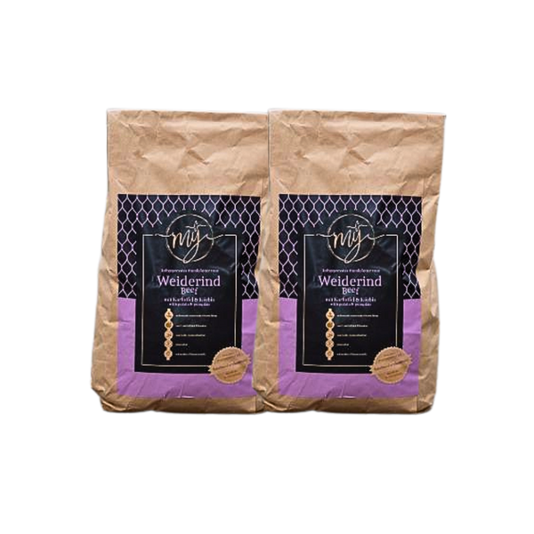 Zwei braune Papiertüten mit violetten Etiketten, beschriftet mit 'mysignature Weiderind, Beef jeweils mit goldfarbenem Siegelaufkleber.
