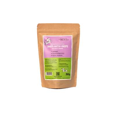 Braune Papierverpackung. Etikette  mit Hundesymbol. Marke The Next Best und Produktnamen: Darm-Aktiv-Drops-350g. 