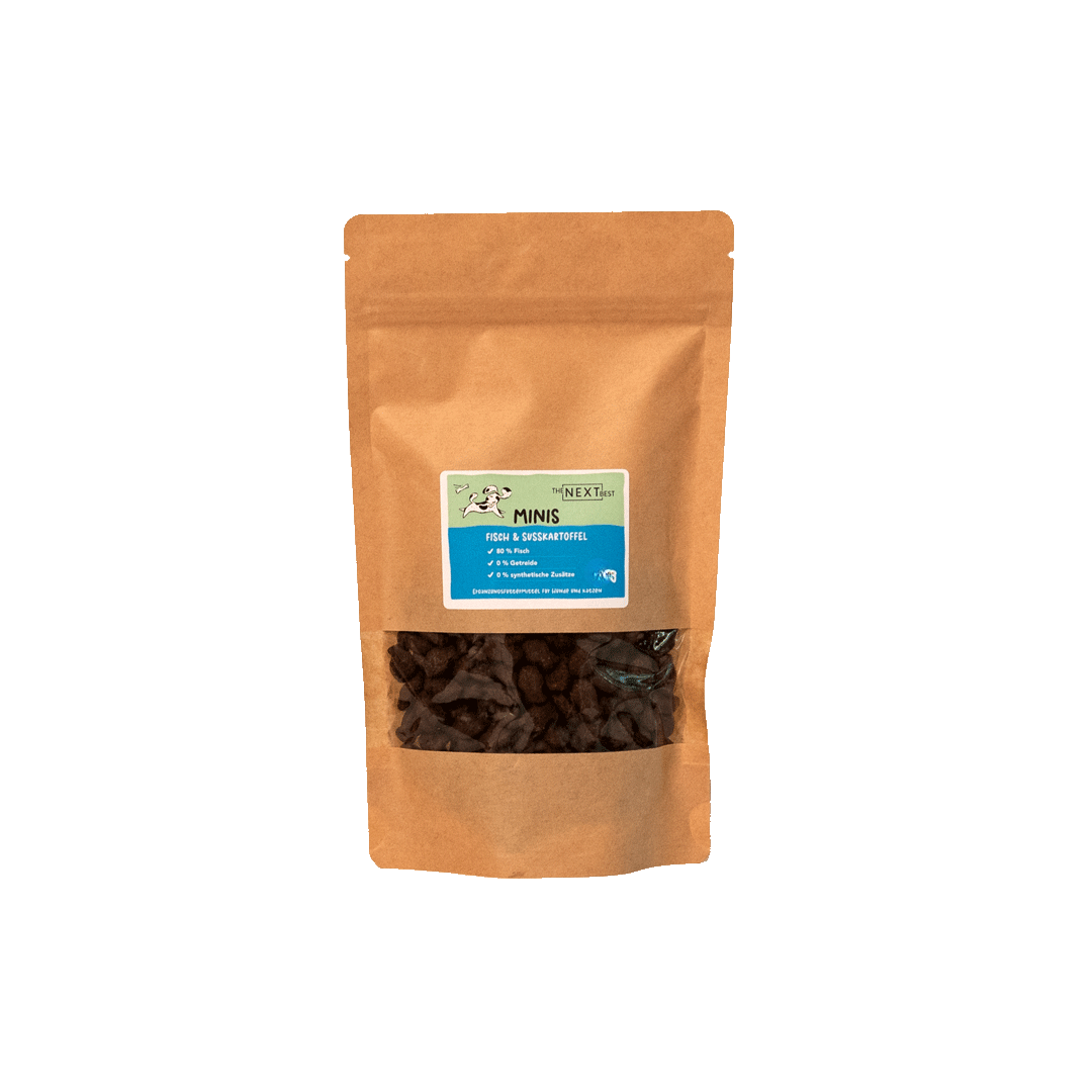 Braune Papiertüte mit Sichtfenster, gefüllt mit kleinen Snacks. Auf dem Etikett steht 'MINIS' und Informationen zu Inhaltsstoffen.