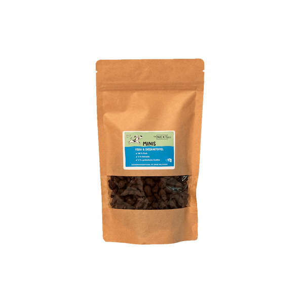 Braune Papiertüte mit Sichtfenster, gefüllt mit kleinen Snacks. Auf dem Etikett steht 'MINIS' und Informationen zu Inhaltsstoffen.