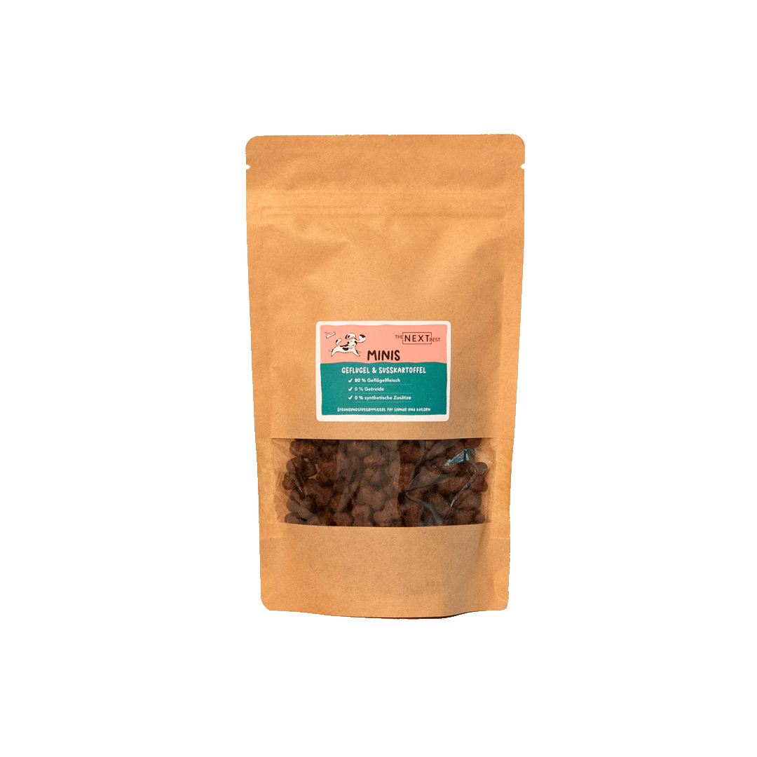 Braune Papiertüte mit Sichtfenster, gefüllt mit kleinen Snacks. Auf dem Etikett steht 'MINIS' und Informationen zu Inhaltsstoffen.