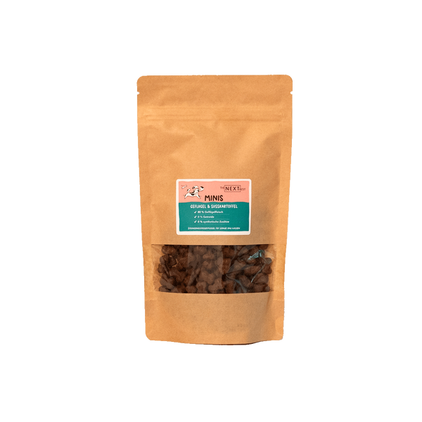 Braune Papiertüte mit Sichtfenster, gefüllt mit kleinen Snacks. Auf dem Etikett steht 'MINIS' und Informationen zu Inhaltsstoffen.